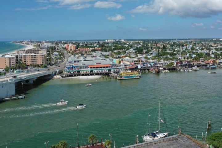 a large body of water with a city in the background