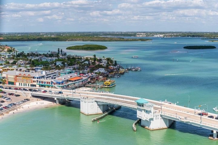 a boat is docked next to a body of water