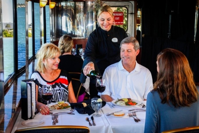 a group of people sitting at a table in a restaurant