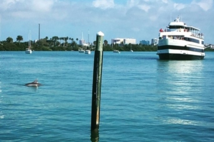 a boat is docked next to a body of water