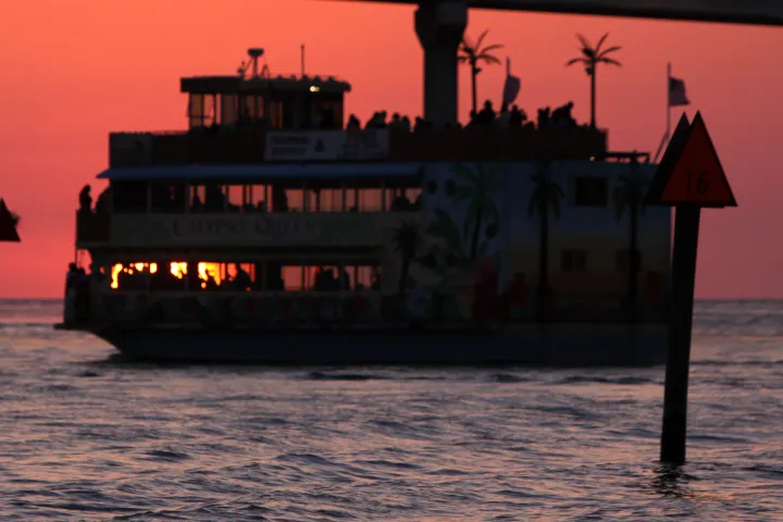 a close up of a pier next to a body of water