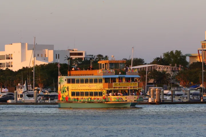 a boat is docked next to a body of water