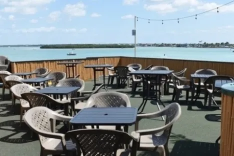 a chair sitting in front of water