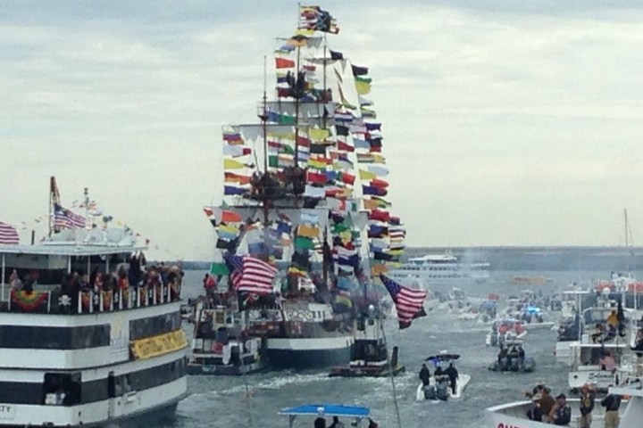 a group of people on a boat in a large body of water