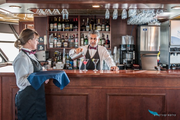 a couple of people that are sitting on a kitchen counter