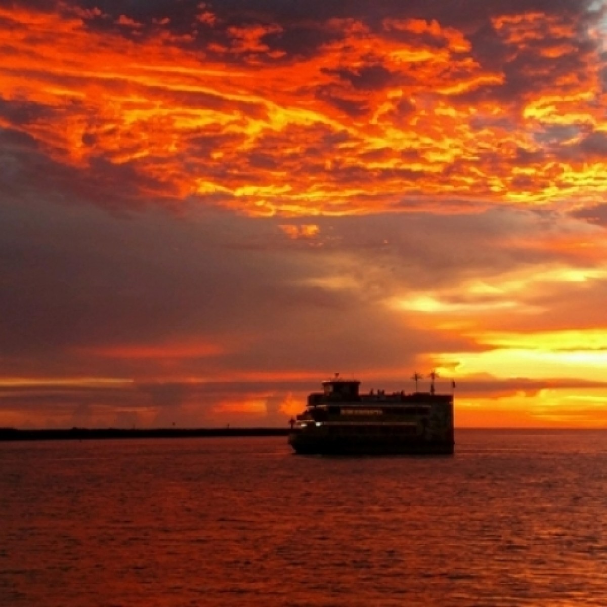 a sunset over a body of water