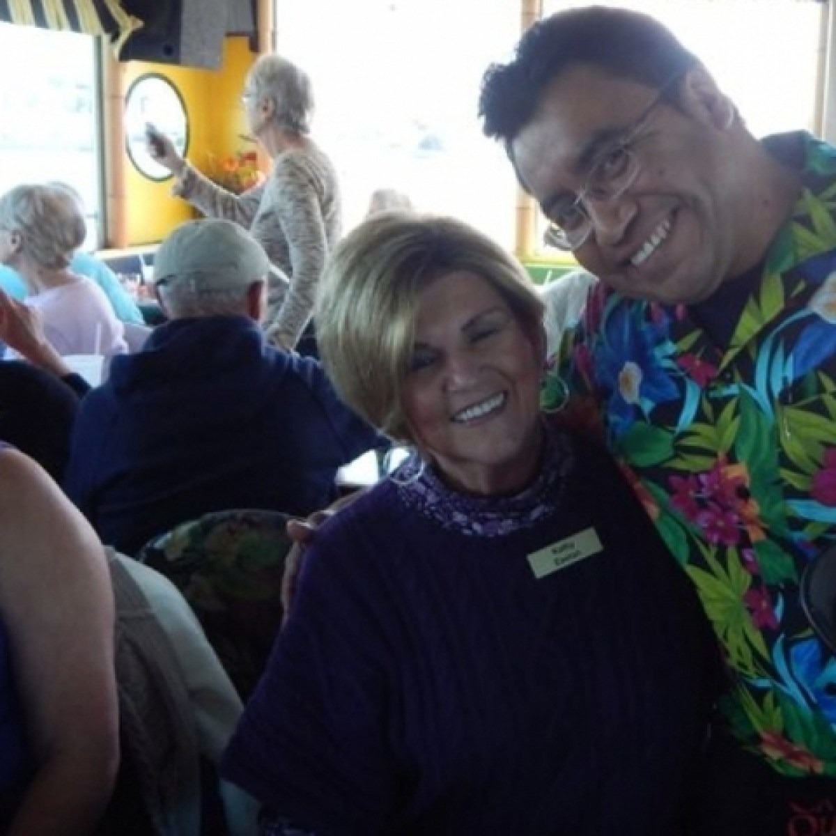 a group of people sitting in front of a window