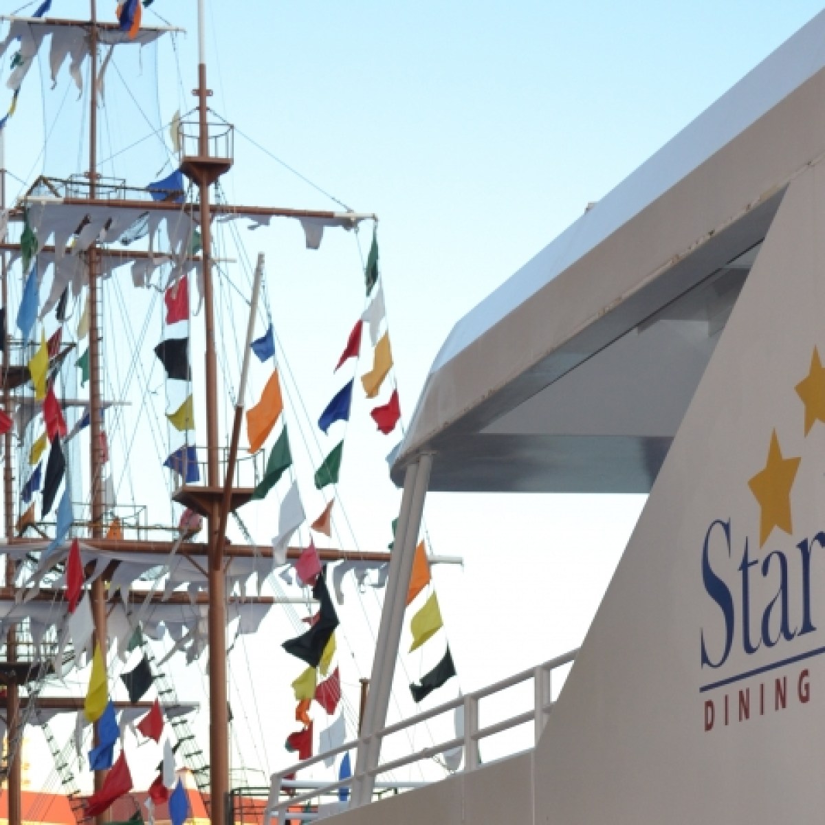 a group of people standing next to a sign