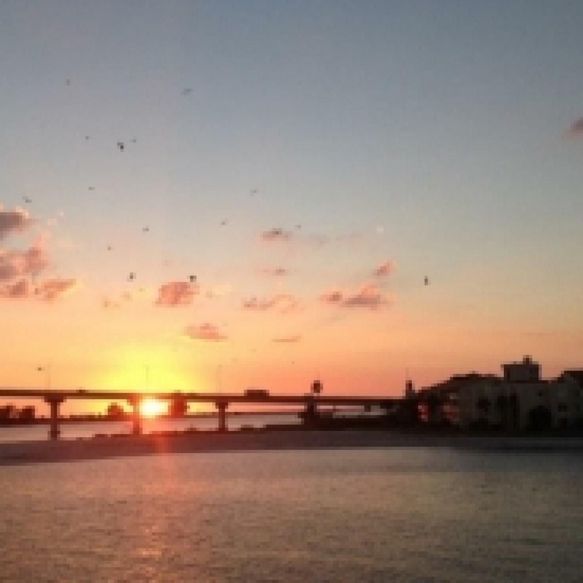 a sunset over a body of water