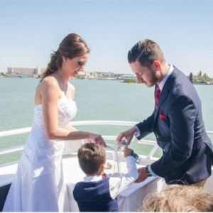 a man and a woman standing in front of water