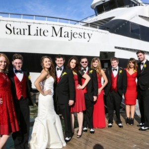 a group of people standing in front of a crowd posing for the camera