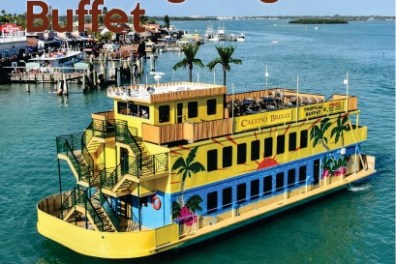 Yellow boat with palm trees and 'Thanksgiving Buffet' text on water near docks.